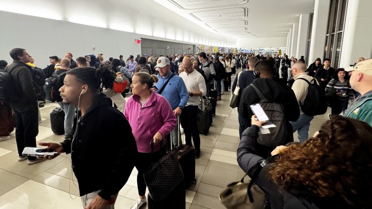 Long wait lines at a TSA checkpoint at New York's LaGuardia airport Friday.